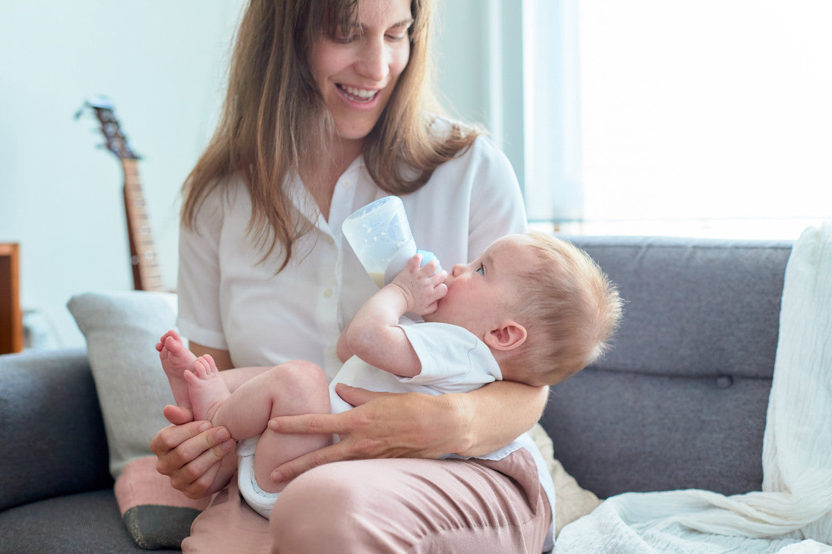 Marcus & Marcus - Silicone Angled Feeding Bottle & Dispensing Spoon Set - Peach - Laadlee